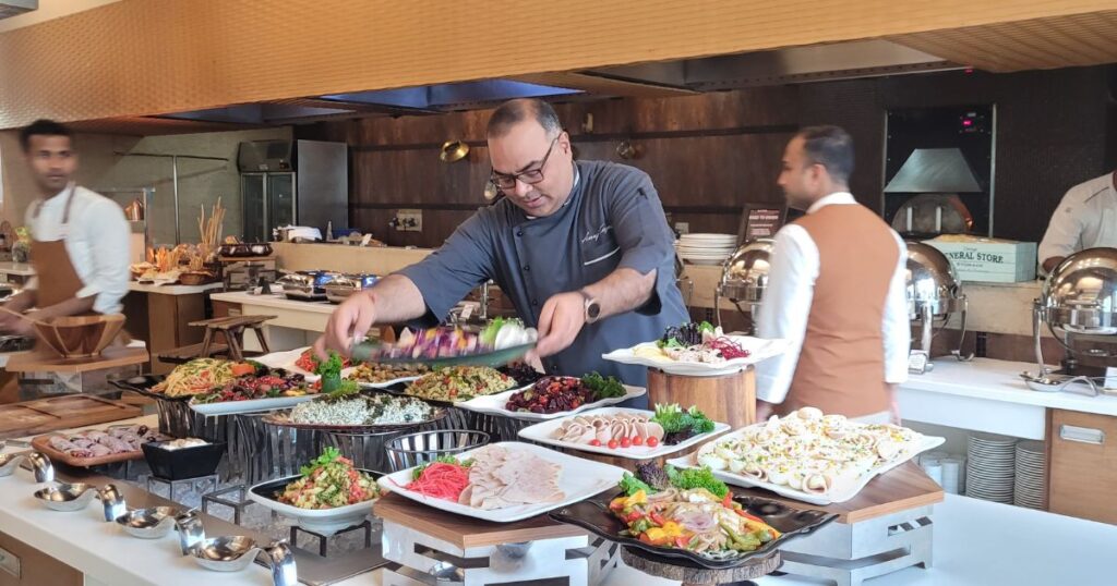 Chef Anuj Kapoor setting the buffet brunch