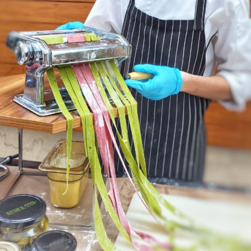our talented chefs crafting fresh Tagliatelle pasta from scratch